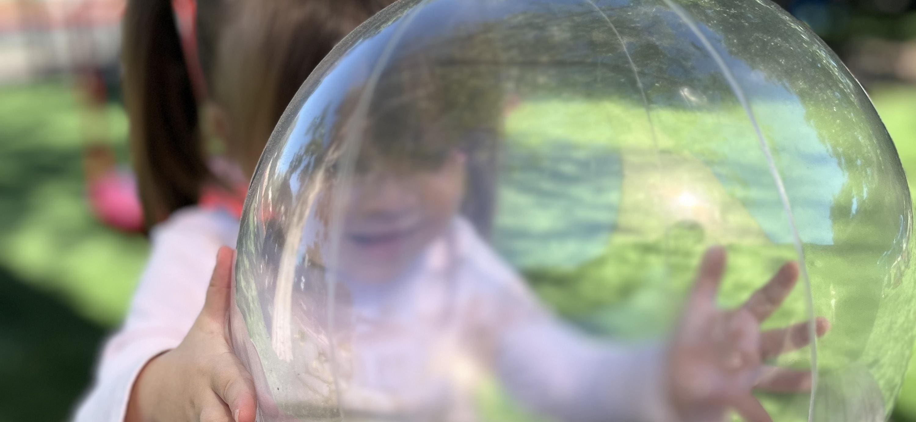 A woman is seen through the lens of a camera.